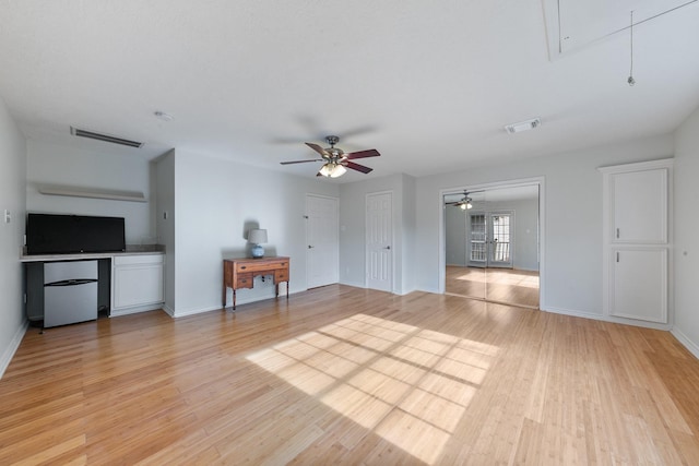 4510 Hazelton St, Houston, TX 77035 - living area with attic access, ceiling fan, light wood-style flooring, and baseboards