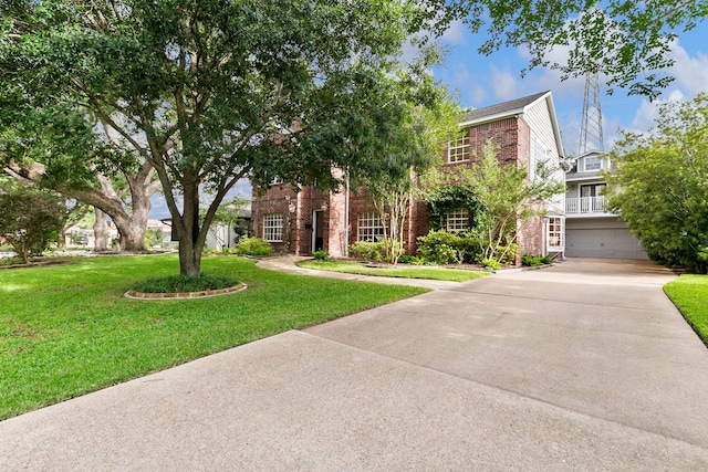 4510 Hazelton St, Houston, TX 77035 - view of front facade with brick siding, a front lawn, driveway, and a garage