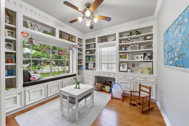 4510 Hazelton St, Houston, TX 77035 - game room featuring crown molding, light wood finished floors, a ceiling fan, plenty of natural light, and baseboards