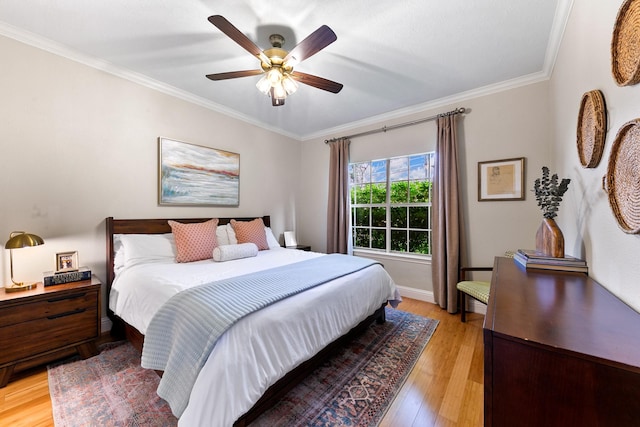 4510 Hazelton St, Houston, TX 77035 - bedroom featuring ornamental molding, light wood-style floors, ceiling fan, and baseboards