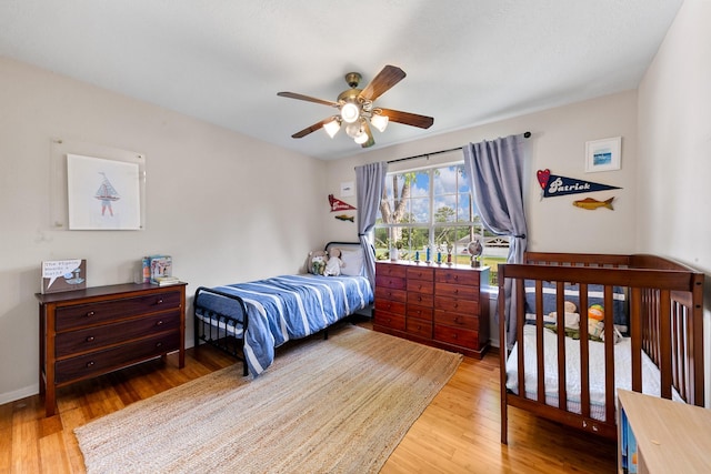 4510 Hazelton St, Houston, TX 77035 - bedroom featuring wood finished floors, a ceiling fan, and baseboards