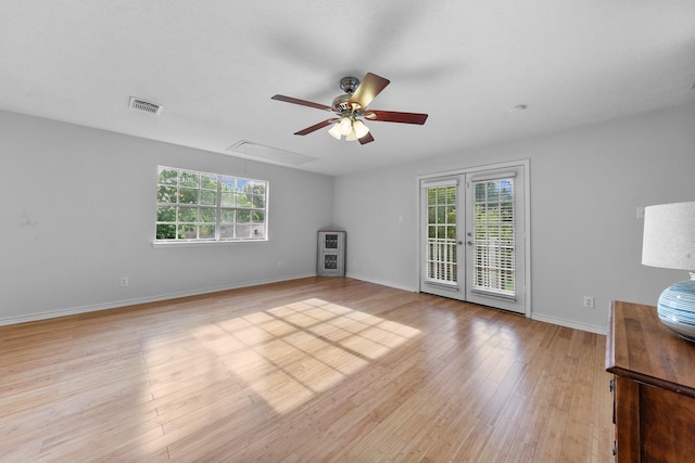 4510 Hazelton St, Houston, TX 77035 - unfurnished living room with attic access, ceiling fan, plenty of natural light, and light wood finished floors