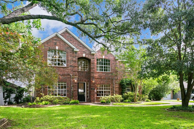 4510 Hazelton St, Houston, TX 77035 - traditional home with brick siding and a front yard