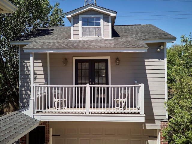 4510 Hazelton St, Houston, TX 77035 - doorway to property with a balcony, a shingled roof, and an attached garage
