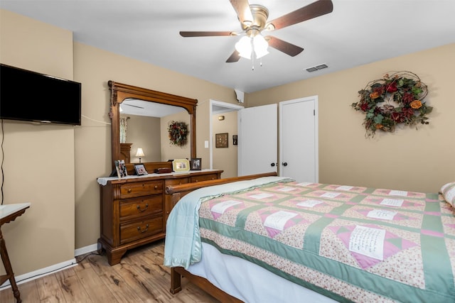 19769 State Highway 21 E, Grapeland, TX 75844 - bedroom featuring light wood-style floors, ceiling fan, and baseboards