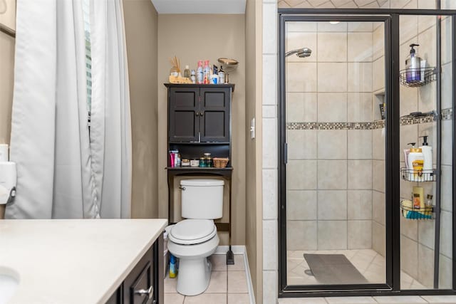 19769 State Highway 21 E, Grapeland, TX 75844 - bathroom featuring a stall shower, tile patterned floors, toilet, and vanity