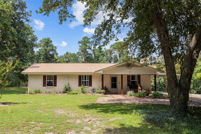19769 State Highway 21 E, Grapeland, TX 75844 - ranch-style home featuring brick siding and a front lawn