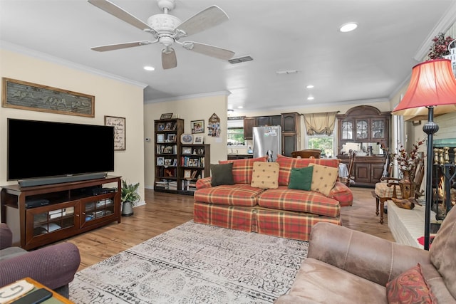 19769 State Highway 21 E, Grapeland, TX 75844 - living area with ornamental molding, recessed lighting, baseboards, light wood finished floors, and a ceiling fan