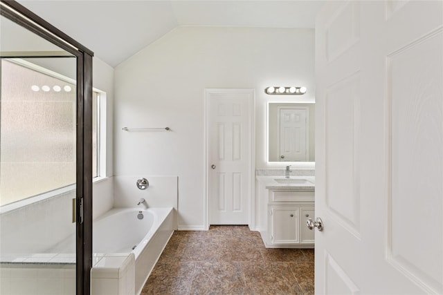 3418 Mcmahon Way, Missouri City, TX 77459 - full bath with vaulted ceiling, vanity, a bath, and baseboards