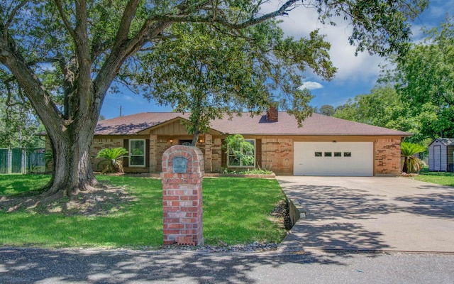 12211 3rd St, Santa Fe, TX 77510 - ranch-style house with concrete driveway, an attached garage, brick siding, and a chimney