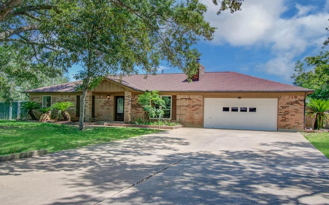 12211 3rd St, Santa Fe, TX 77510 - ranch-style home featuring driveway, brick siding, a garage, a front lawn, and a chimney