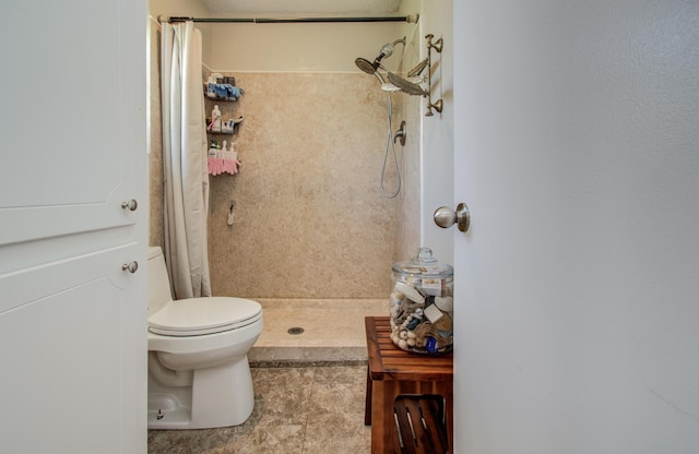 12211 3rd St, Santa Fe, TX 77510 - bathroom featuring tiled shower, tile patterned floors, and toilet