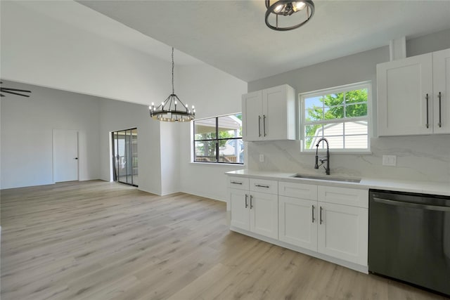 964 Lake View Dr, Montgomery, TX 77356 - kitchen with dishwasher, a sink, a chandelier, light wood-style floors, and light countertops