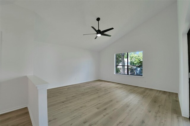 964 Lake View Dr, Montgomery, TX 77356 - spare room featuring light wood-style flooring, ceiling fan, baseboards, and high vaulted ceiling