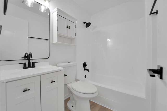 964 Lake View Dr, Montgomery, TX 77356 - bathroom with vanity, toilet, shower / tub combination, and wood finished floors