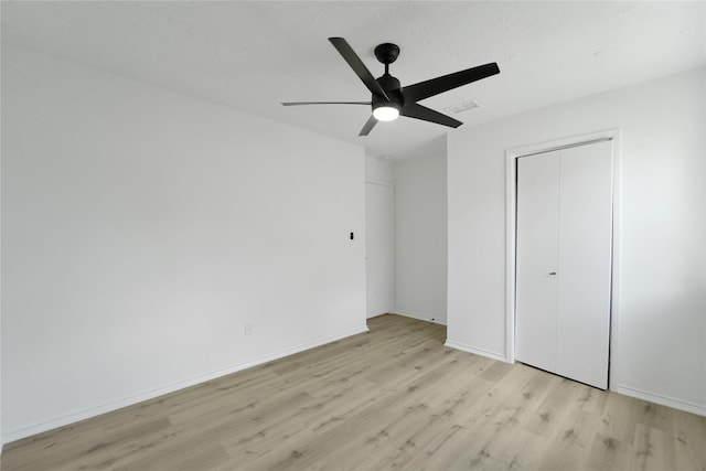 964 Lake View Dr, Montgomery, TX 77356 - unfurnished bedroom with light wood-type flooring, ceiling fan, a closet, and baseboards