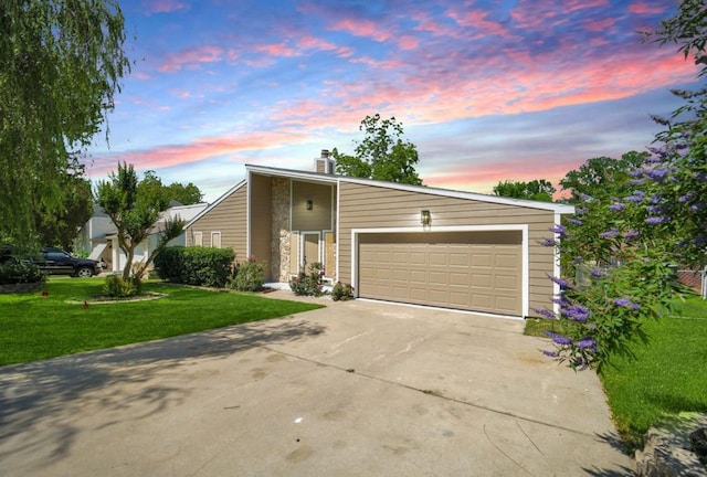 964 Lake View Dr, Montgomery, TX 77356 - mid-century inspired home featuring concrete driveway, a yard, a chimney, and an attached garage