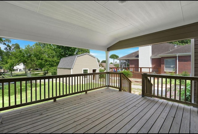 964 Lake View Dr, Montgomery, TX 77356 - deck with an outbuilding, a storage unit, a residential view, and a lawn