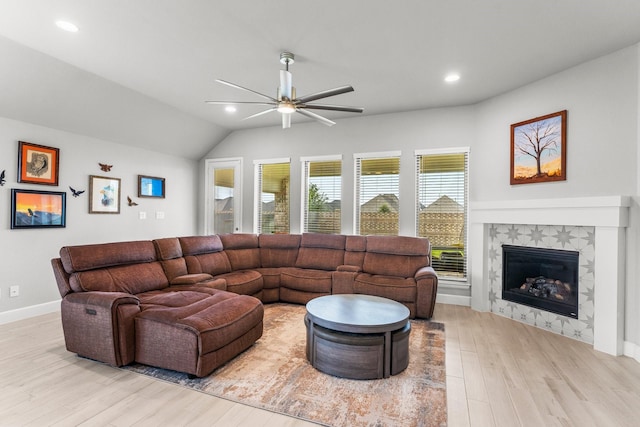19227 Seabiscuit Stable Trl, Tomball, TX 77377 - living area with wood finished floors, a ceiling fan, recessed lighting, a tiled fireplace, and vaulted ceiling