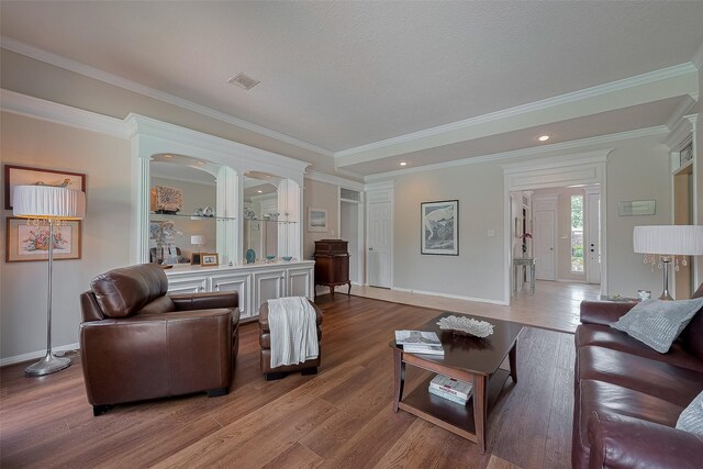 5807 Juniper Knoll Ln, Houston, TX 77345 - living room featuring baseboards, wood finished floors, ornamental molding, and recessed lighting
