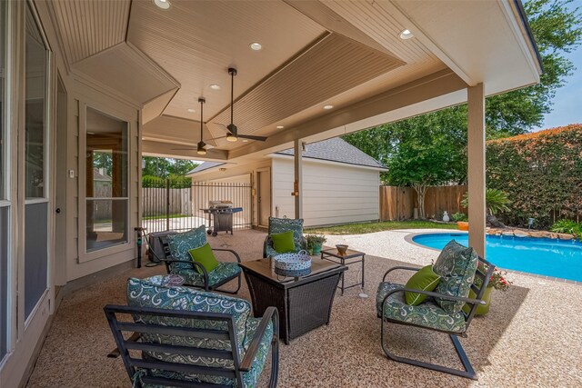 5807 Juniper Knoll Ln, Houston, TX 77345 - fenced backyard featuring a patio area, outdoor lounge area, ceiling fan, and area for grilling