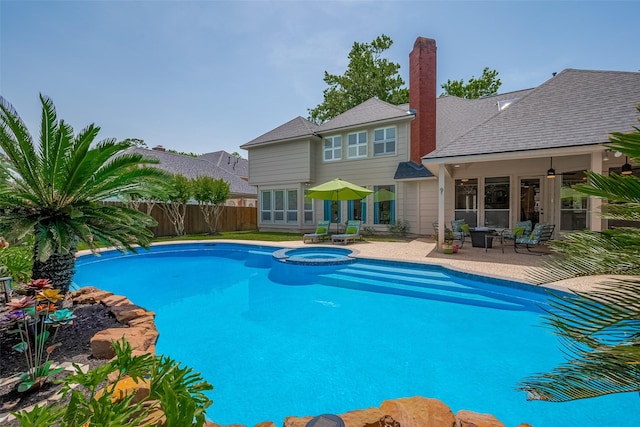 5807 Juniper Knoll Ln, Houston, TX 77345 - view of swimming pool featuring a patio, a fenced backyard, and a pool with connected hot tub