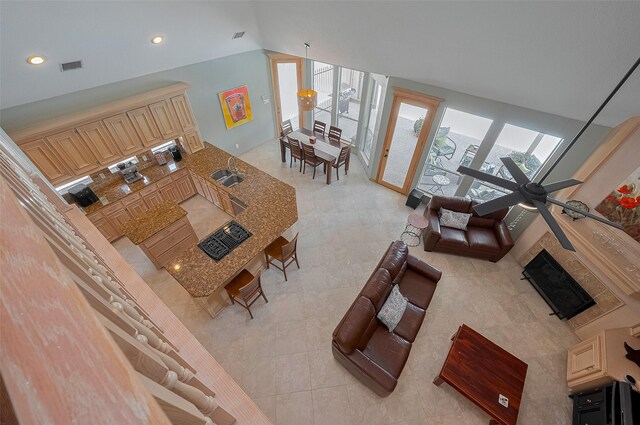 5807 Juniper Knoll Ln, Houston, TX 77345 - living area featuring lofted ceiling, light tile patterned flooring, and recessed lighting