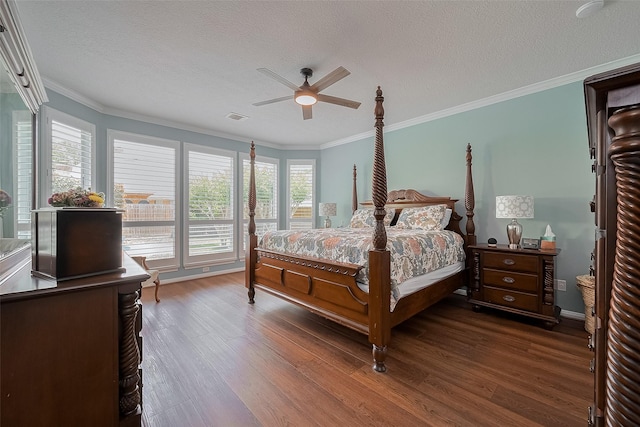 5807 Juniper Knoll Ln, Houston, TX 77345 - bedroom with wood finished floors, crown molding, a textured ceiling, ceiling fan, and baseboards