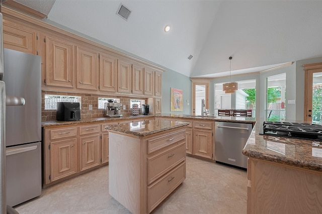 5807 Juniper Knoll Ln, Houston, TX 77345 - kitchen with stainless steel appliances, a sink, stone countertops, tasteful backsplash, and light brown cabinets