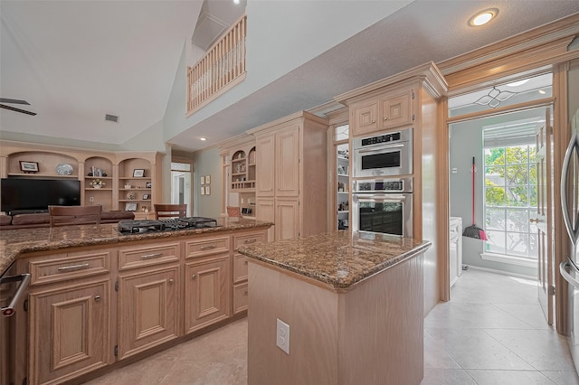 5807 Juniper Knoll Ln, Houston, TX 77345 - kitchen with open floor plan, stone countertops, appliances with stainless steel finishes, a center island, and light tile patterned floors