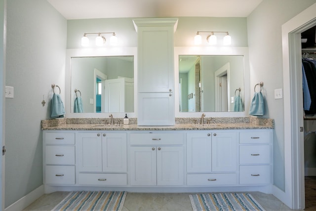 18084 Morning Dove Cir, College Station, TX 77845 - full bath featuring baseboards, double vanity, and a spacious closet