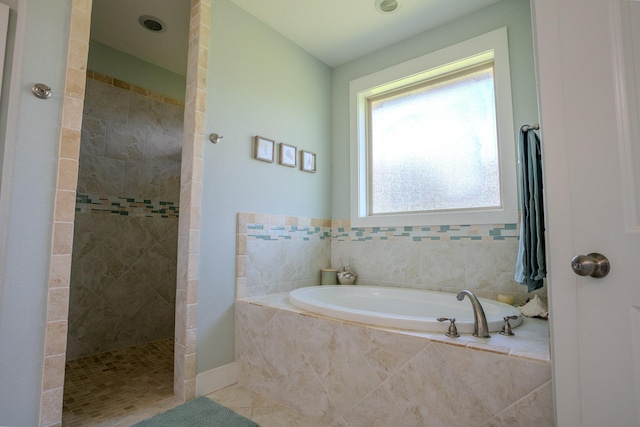 18084 Morning Dove Cir, College Station, TX 77845 - full bath featuring walk in shower, a garden tub, and tile patterned flooring