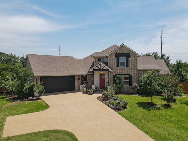 18084 Morning Dove Cir, College Station, TX 77845 - view of front of home featuring concrete driveway, a garage, brick siding, and a shingled roof