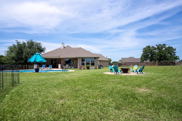 18084 Morning Dove Cir, College Station, TX 77845 - back of property featuring an outdoor fire pit, a patio, and brick siding