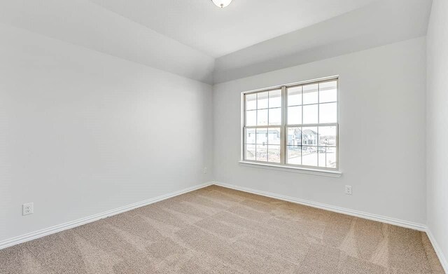 2007 Sunflower Ct, Sugar Land, TX 77498 - carpeted spare room featuring baseboards and lofted ceiling