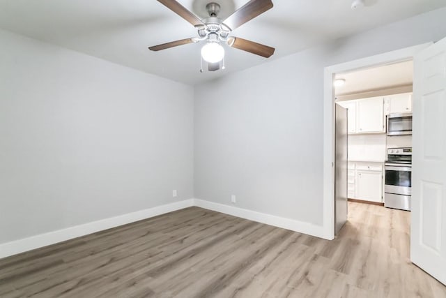 207 W Saunders St, League City, TX 77573 - unfurnished room featuring light wood-style flooring, baseboards, and ceiling fan