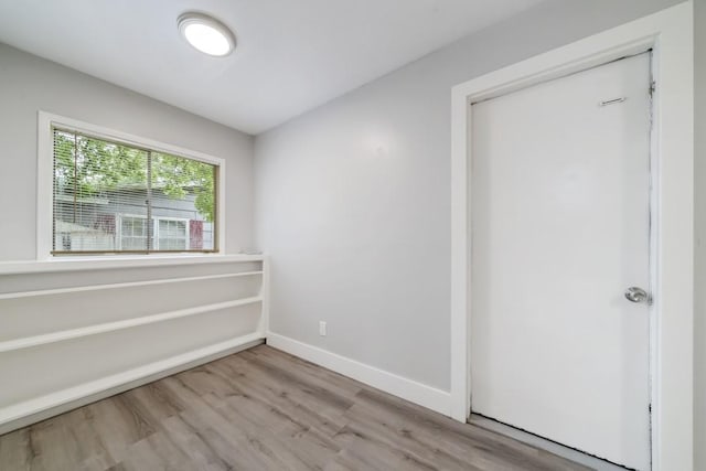 207 W Saunders St, League City, TX 77573 - empty room featuring wood finished floors and baseboards