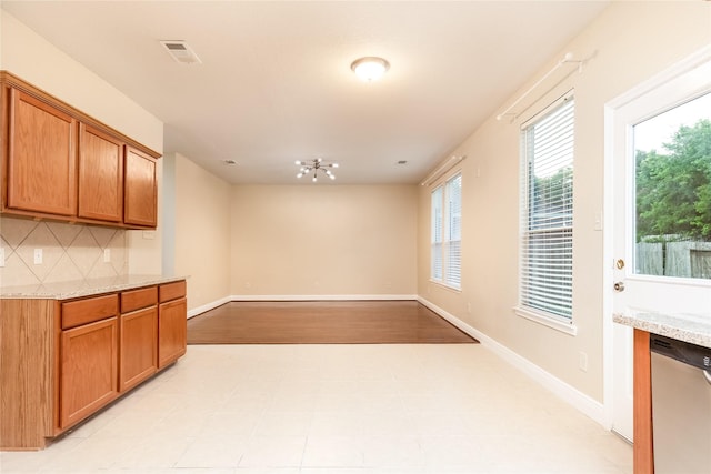 9726 Angleside Ln, Sugar Land, TX 77498 - unfurnished dining area with baseboards