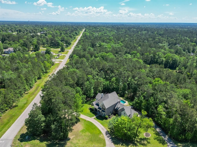 15557 Crown Oaks Dr, Montgomery, TX 77316 - aerial view of property and surrounding area with a heavily wooded area