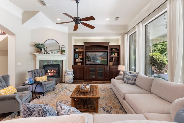 15557 Crown Oaks Dr, Montgomery, TX 77316 - living room with wood finished floors, a ceiling fan, a high end fireplace, ornamental molding, and recessed lighting