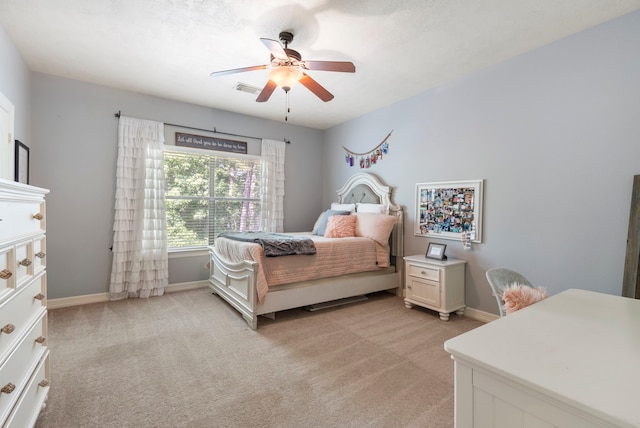 15557 Crown Oaks Dr, Montgomery, TX 77316 - bedroom featuring light colored carpet, baseboards, and ceiling fan