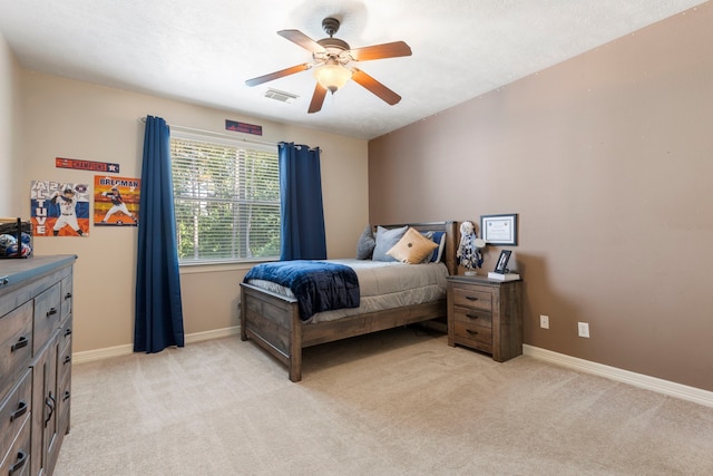 15557 Crown Oaks Dr, Montgomery, TX 77316 - bedroom with light carpet, baseboards, and ceiling fan