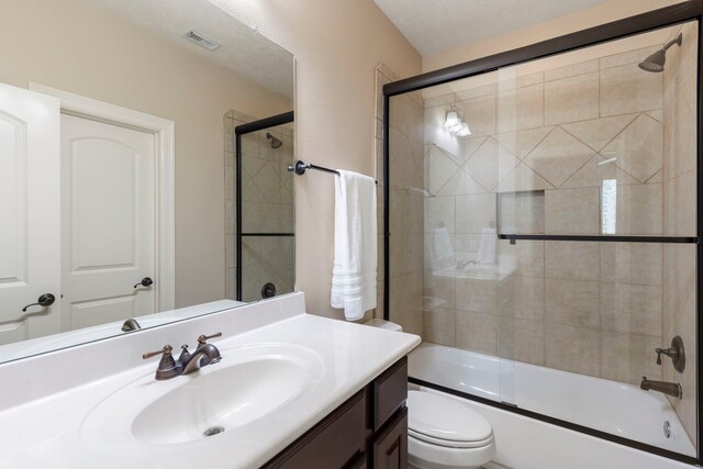 15557 Crown Oaks Dr, Montgomery, TX 77316 - bathroom featuring vanity, toilet, and enclosed tub / shower combo