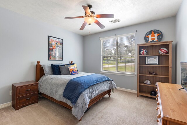 15557 Crown Oaks Dr, Montgomery, TX 77316 - bedroom with light colored carpet, baseboards, and a ceiling fan