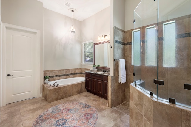 15557 Crown Oaks Dr, Montgomery, TX 77316 - full bathroom with vanity, a bath, a stall shower, a chandelier, and tile patterned floors