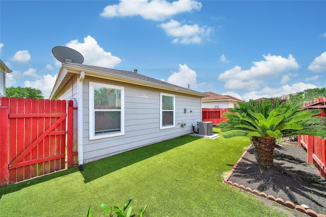 back of house featuring cooling unit