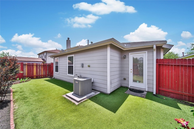 back of property with central AC