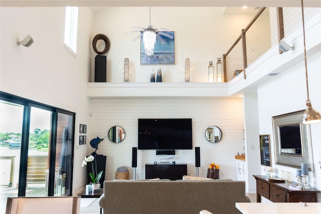 29 Cmdr Runco Ln, Taylor Lake Village, TX 77586 - living area with a towering ceiling and wood walls