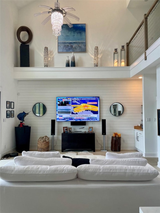 29 Cmdr Runco Ln, Taylor Lake Village, TX 77586 - living area with a ceiling fan and wood walls