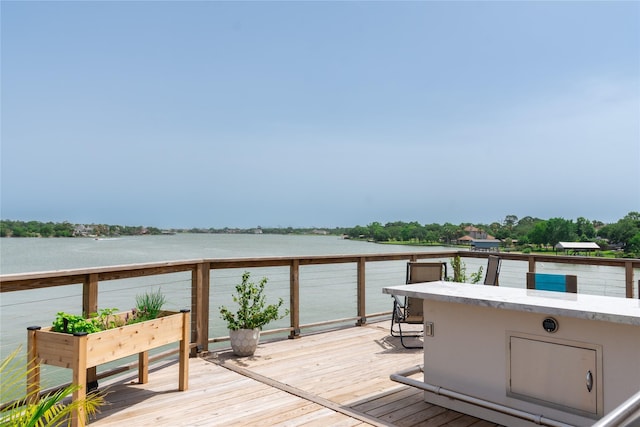 29 Cmdr Runco Ln, Taylor Lake Village, TX 77586 - wooden terrace featuring a water view